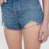 Distressed shorts in mid blue wash